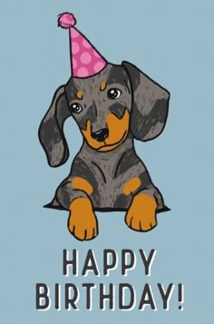 a dog with a party hat on its head is sitting in front of a happy birthday card