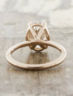 a gold ring with a diamond in the center