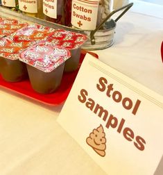 an assortment of ice creams on a table with labels for stock samples and other items