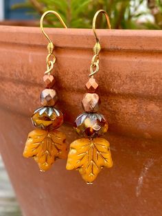 Lovely Czech Glass Beaded Fall Earrings! 🍂 Length is 1.75 inches long. Dainty!  Beautiful orange, gold, and burnt Carmel coloring!  Stainless steel gold tone earring wires.   Earrings come with a pretty earring card.  Happy fall! Diy Thanksgiving Earrings, Fall Earrings Beaded, Diy Fall Earrings, Diy Fall Jewelry, Czech Beads Jewelry, Whimsical Earrings, Autumn Earrings, Fall Bead, Autumn Jewelry