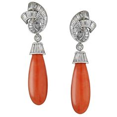 Each suspending a smooth coral drop, from a platinum cap, accented by baguette-cut diamonds these gorgeous David Webb earrings are absolutely stunning. Earrings are 3.4 inches long, the coral drop is detachable. Clip-on backs. Diamonds: Baguette cuts, Round Brilliant Cuts Diamond Weight: approx. 16 carat total Each Coral: 2 inches long Earring Length without coral drop: 1 inch It comes in David Webb box. Convertible Earrings, Coral Jewelry Set, Haute Jewelry, Yellow Gold Drop Earrings, Long Earring, Fine Jewelery, David Webb, Coral Jewelry, Sparkle Earrings