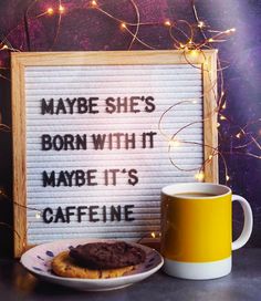 a sign that says maybe she's born with it maybe it's caffeine