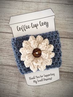 a crocheted card holder with a flower on it