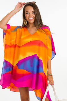 This caftan will have everyone looking your way! It's effortlessly stylish and oh so comfortable + with its lightweight and airy fabric, it's just right for summer! The wide sleeves are stitched down both sides, and caftan is also lined. Wear it as a tunic, dress, or a swimsuit cover up... you can't go wrong here! Flowy V-neck Tunic For Beach Cover-up, Oversized V-neck Spring Cover-up, Summer V-neck Relaxed Fit Kaftan, Free Size Kaftan For Spring Beach Cover-up, Summer Beach Cover-up Flowy Blouse, Flowy V-neck Breezy Cover-up, Oversized V-neck Tunic For Beach Cover-up, Vibrant Print V-neck Tunic, Multicolor Poncho For Beach Cover-up In Summer