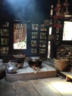 an outdoor cooking area with pots and pans