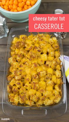 cheesy tater tot casserole in a glass dish on a wooden table