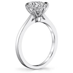 a white gold ring with an oval cut diamond