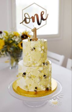 a three tiered cake sitting on top of a table