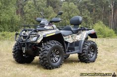 a four wheeler is parked in the grass