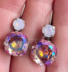 Gorgeous Violet Shimmer Crystal Drop Earrings ! These are perfect for every Season - neutral pink colors!  The colors of these stones is fabulous and these look great with everything - jeans too! ❤️. Beautiful 12mm Square Cushion Cut Violet Shimmer ( pinky purple larger stone) Swarovski Crystals accompanied by Rose Water Opal 29ss Swarovski Round Crystals. These look like huge sparkly pinkish  diamonds. Handset in an Antiqued Silver Colored Patina  Setting on Lever Back Closures. These are stunning and can be worn everyday or for that special occasion .  Perfect Gift. These will come gift wrapped in our signature organza bag.  FREE SHIPPING IN USA 🇺🇸 Pink Jewelry With Matching Earrings For Birthday, Pink Crystal Round Earrings For Gift, Nickel-free Pink Earrings For Birthday, Pink Earrings With Lever Back For Anniversary, Pink Lever Back Earrings For Anniversary, Pink Sparkling Crystal Earrings Gift, Pink Sparkling Crystal Earrings For Gift, Pink Round Earrings For Birthday, Pink Round Birthday Earrings