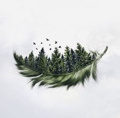 a green feather flying through the air with trees on it