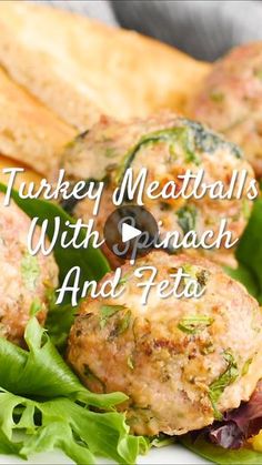 turkey meatballs with spinach and feta on a bed of lettuce