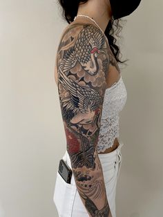 a woman with a tattoo on her arm