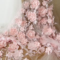 pink flowers and sheer fabric on a table