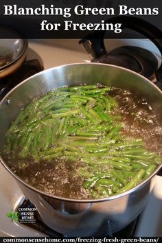 a pot filled with green beans on top of a stove