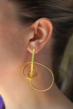 Musical note inspired abstract contemporary gold statement earrings. Perfect gift for musician friend. Material: Brass (100% skin friendly) Coating: 18 Kt Gold (thick layer)  Making: 100% Handmade Electrophoretic Coating for Scratch Resistance & Long Life Nickel, Lead & Cadmium Free (International Lab Certificate) Modern Gold Wrap Earrings For Pierced Ears, Modern Gold Single Wrap Earring, Modern Yellow Gold Wrap Earrings, Modern Brass Wrap Earrings For Gift, Modern Brass Wrap Earrings As Gift, Modern Brass Wrap Earrings, Modern Gold Earrings With Unique Design, Edgy Earrings, Abstract Jewelry