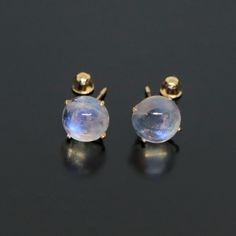 You are buying cute14k solid yellow gold natural Blue Fire Moonstone 6 - 7mm round untreated cabochon stone stud screw back earrings.  Metal:14k solid yellow gold Stone: Natural Blue untreated cabochon Fire Moonstone (6-7mm approx.) Closure: Screw back  Earrings style: Stud Total weight: 0.7 - 0.9 grams IMPORTANT NOTE: These pictures are maximum zoomed in, so the actual size of the jewelry is noted in the description. We strongly suggest that you pay attention to the numbers of written sizes. If you want to look closer, you can use a magnifying glass. The item color may slightly vary due to photographic lighting sources. We work very hard to make our photos as life-like as possible, however, please try to understand that it can be slightly different from your monitor. Please, be aware that Moonstone Round Yellow Gold Earrings, Moonstone Yellow Gold Round Earrings, Round Moonstone Yellow Gold Earrings, Round Moonstone Cabochon Earrings, Yellow Gold Round Moonstone Earrings, Blue Moonstone, Earrings Metal, Stone Studs, Round Stud Earrings