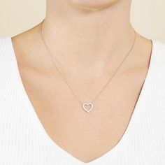 Simple and sleek best describes this Silver Treasures sterling silver Cubic Zirconia heart pendant necklace. This necklace is crafted in quality sterling silver, features beautiful sparkling Cubic Zirconia stones, comes in 16 inches with a 2 inch extender and has a spring ring clasp for a safe and comfortable wear. Wear this pendant necklace alone or stack with your other favorite necklaces. Wipe necklace clean with a soft cloth.Features: Nickel FreeJewelry Closure: Spring Ring ClaspLink Constru Silver Heart Pendant Necklace With Brilliant Cut, Sterling Silver Heart Pendant Necklace With Brilliant Cut, Sterling Silver Heart Necklace With Brilliant Cut Pendant, Sterling Silver Brilliant Cut Heart Pendant Necklace, Sterling Silver Heart Necklace With Brilliant Cut, Diamond White Heart Charm Sterling Silver Necklace, Silver Open Heart Necklace With Brilliant Cut, Diamond White Heart-shaped Sterling Silver Necklace, Open Heart White Gold Necklace With Cubic Zirconia