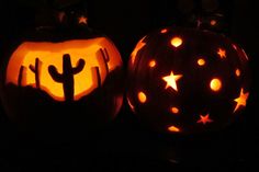 two carved pumpkins with cactus and stars on them