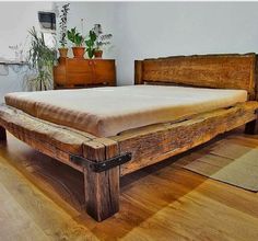 a bed frame made out of wood planks with the words we have made 3 of our wood plans bedroom finest examples available on this blog, totally free