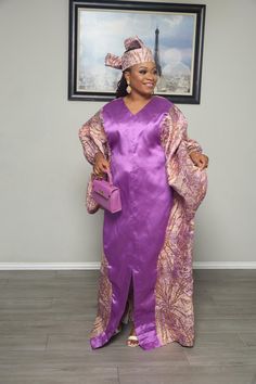 Make a bold entrance with this eye-catching Purple and Gold Kaftan Dress. Featuring a vibrant purple center with shimmering gold and purple patterned side panels, this dress is the perfect blend of luxury and style. The V-neckline and wide sleeves provide an elegant touch, while the matching headscarf completes the ensemble for a coordinated and polished look. Whether you're attending a special event or celebrating a formal occasion, this kaftan will ensure you stand out with confidence and grac Fitted V-neck Kaftan For Party, Elegant Purple Kaftan For Party, Long Sleeve Purple Party Kaftan, Elegant Purple Long Sleeve Kaftan, Elegant Purple Party Kaftan, Fitted V-neck Party Kaftan, Gold V-neck Kaftan For Party, Elegant Long Purple Dresses, Festive V-neck Satin Dresses