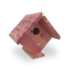 a wooden birdhouse on a white background