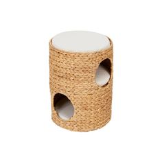 a wicker stool with two holes in the middle