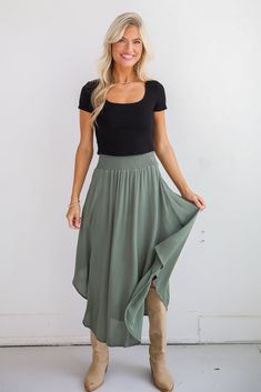 If you have iconic intentions, then the Sensational Purpose Olive Midi Skirt is the perfect look to achieve them! Designed with a flattering high-waisted fit, this skirt gracefully drapes to a midi length, creating a beautiful, flowing silhouette that moves with you. The rich olive hue adds a sophisticated, earthy tone that pairs beautifully with both neutrals and vibrant colors, making it a versatile addition to any closet. Crafted from lightweight, breathable fabric, this skirt offers a soft, Modest Stretch Skirt With Elastic Waistband, Chic Spring Skirt With Wide Waistband, Chic Non-stretch Lined Skirt, Spring Tiered Skirt With Wide Waistband, High Waist Flowy Skirt With Wide Waistband, Chic Non-stretch Lined Maxi Skirt, Chic Flowy Flared Skirt Bottoms, Chic Non-stretch Tiered Skirt, Chic Non-stretch Skirt With Elastic Waistband