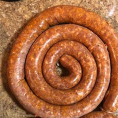 two sausages sitting on top of a counter next to each other