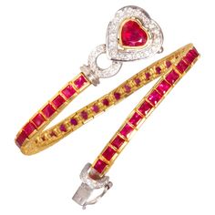 The ruby and diamond bracelet features a row of especially calibrated square rubies (12.60 carats). The clasp consists of a heart shape ruby (1.45 carats) surrounded by round diamonds. The total weight of diamonds is 0.50 carats. The rubies are of brilliant intense color and crystalline texture. The diamonds are top quality (F/G-VVS). The design is accented by the use of both white and yellow 18 carat gold. The bracelet was handmade in Italy in our own workshop according to an original design by Ruby Bracelets, Diamond Bracelet Design, Ruby Heart, Bracelet Tennis, Ruby Bracelet, Modern Bracelets, Jewelry Lookbook, Fabulous Jewelry, Ruby Diamond