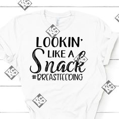 Breastfeeding Moms Stay Looking Like A Snack. This Lookin Like A Snack #Breastfeeding Tee Is The Perfect Tee For You. Available In Most Sizes, Vneck Or Crew Neck, White, Short Or Long Sleeve (Additional $7). Specify When Ordering Or We Will Choose For You. Ask About Other Colors Availability When Ordering. Made When Ordered. Get Yours Today!! Breastfeeding Shirts, Looking Like A Snack, Breastfeeding Shirt, White Short, Bella Canvas, Womens Tops, Tops & Tees, Crew Neck, Snacks