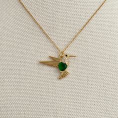 Cute Gold Humming Bird Necklace with Emerald Green Zircon, Flying Bird Necklace for Women and Girls Perfect for a gift to your lovers, friends, and yourself! Item details ✰ Color: gold ✰ Green or Red crystal  ✰ 14K gold plated shimmering chain  ✰ High-quality clasp  ✰ You can choose the necklace length 15-19 inches when you check out Flying Bird, Humming Bird, Bird Necklace, Red Crystals, Birds Flying, Necklace Length, Necklace For Women, Emerald Green, Favorite Jewelry