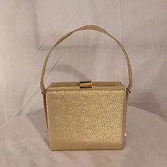 Nwot Dollargrand (London) Gold Handbag With Strap. This Beautiful Handbag Features A Sparkly Gold Material With Gold Accents Throughout, Small Strap With Snap In Closure. Interior Features 1 Zip Compartment And 2 Outer Open Compartments. The Perfect Bag To Compliment Your Hot Outfits . Rectangular Box Bag With Gold-tone Hardware For Shopping, Square Bags With Gold-tone Hardware For Shopping, Rectangular Satchel With Gold-tone Hardware For Shopping, Gold Box Bag With Removable Pouch For Shopping, Gold Rectangular Box Bag For Daily Use, Gold Rectangular Shoulder Bag For Daily Use, Rectangular Gold Box Bag For Daily Use, Gold Tote Box Bag With Top Carry Handle, Gold Square Box Bag For Shopping