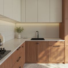 a kitchen with wooden cabinets and white counter tops