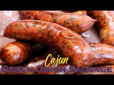 green onion sausages piled on top of each other with the words crayon written above them