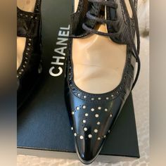 These Chanel Beauties Are Vintage And Come With Original Shoe Bags And Box. They Are A 37.5 Size. I Do Believe They Would Be Best For A 6.5-7 And/Or Medium Or Narrow Foot. Having Said That, I Am A 7 With Medium Width And They Fit Me Fine. The Leather Is Soft. They Have Been Kept In Their Bags And Stored Carefully. Purchased At Saks. One Tiny Spot Is Noted And They Have Brand New Heel Caps. No Gashes On Heels Or Toes- Pristine. Ask Any Questions! Elegant Perforated Pointed Toe Heels, Elegant Round Toe Heels With Perforations, Elegant Pointed Toe Heels With Perforations, Formal Perforated Pointed Toe Heels, Elegant Heels With Round Toe And Perforations, Elegant Black Heels With Laces, Formal Heels With Perforations And Pointed Toe, Elegant Leather Heels With Laces, Elegant Heels With Perforations