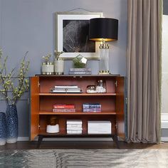 a living room with a book shelf and vases