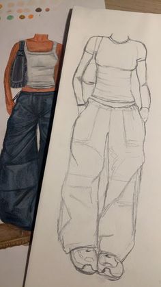 a drawing of a woman's top and pants next to a piece of paper