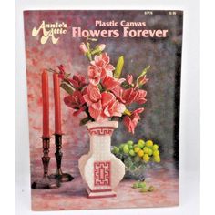 an image of a magazine cover with flowers in vases and candles on the table