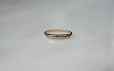 a gold ring sitting on top of a white counter