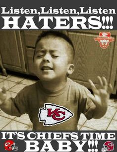 a young boy holding his hands up with the words it's chiefs time baby