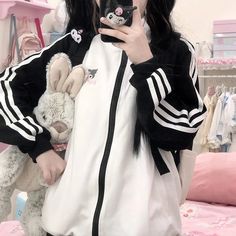 Featuring iconic Sanrio characters, such as Kuromi and Hello Kitty, this hoodie brings a touch of nostalgia and cuteness to your wardrobe. Perfect for showcasing your love for Hello Kitty, My Melody, and other beloved characters, making a fashion statement that's both cozy and kawaii.