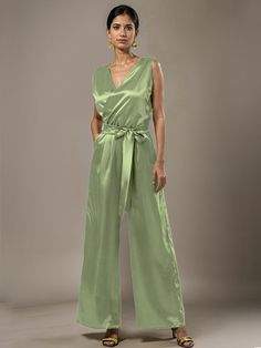 This soft satin jumpsuit features a flattering v-neck design, making it the perfect choice for mothers of the bride. Its dress pantsuit style provides comfort and elegance, while its high-quality material ensures a polished look. Stay stylish and comfortable on that special day with our jumpsuit. Sleeveless Satin Jumpsuit Or Romper, Sleeveless Satin Jumpsuits And Rompers, Sleeveless Solid Color Satin Jumpsuits And Rompers, Chic Satin V-neck Jumpsuits And Rompers, Elegant Satin Jumpsuit Or Romper In Solid Color, Formal Satin V-neck Jumpsuit, Chic Sleeveless Satin Jumpsuit, Elegant Sleeveless Green Pantsuit, Elegant V-neck Spring Pantsuit