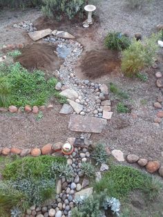 an aerial view of a garden with rocks and gravel