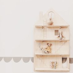 there is a wooden shelf with toys on it