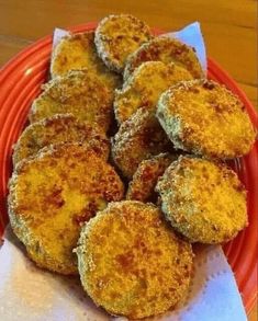 some fried food is on a red plate