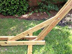 a wooden structure sitting in the grass