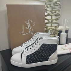 Brand New Designer White High-top Sneakers With Round Toe, Luxury High-top Lace-up Sneakers With Logo, Luxury White High-top Sneakers With Logo-print Tongue, Luxury White Sneakers With Red Sole, Designer White Lace-up High-top Sneakers, Luxury White High-top Sneakers With Logo Print, Luxury Men's Lace-up High-top Sneakers, Christian Louboutin Mens Sneakers, Black High Tops