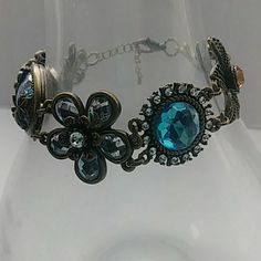 Gorgeous Jeweled Costume Bracelet. Floral Designs With Sparkling Jewels In The Color Of Blue, Gold, And Clear. A Romantic, Pretty, And Feminine Look. Measures 7 Inches Long With A 2 Inch Extender. Never Worn. Blue Jeweled Bracelets As Gift, Blue Costume Jewelry Bracelets For Formal Occasions, Blue Jeweled Bracelets For Party, Formal Blue Costume Jewelry Bracelets, Blue Metal Bracelets For Wedding, Blue Jeweled Party Bracelets, Blue Metal Wedding Bracelets, Vintage Blue Bracelets For Party, Blue Costume Jewelry Bracelet