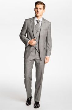 a man in a gray suit and tie